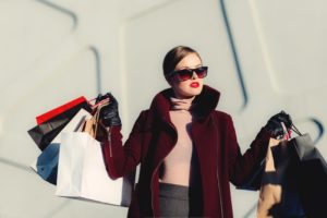 Beautiful carrying lots of shopping bags